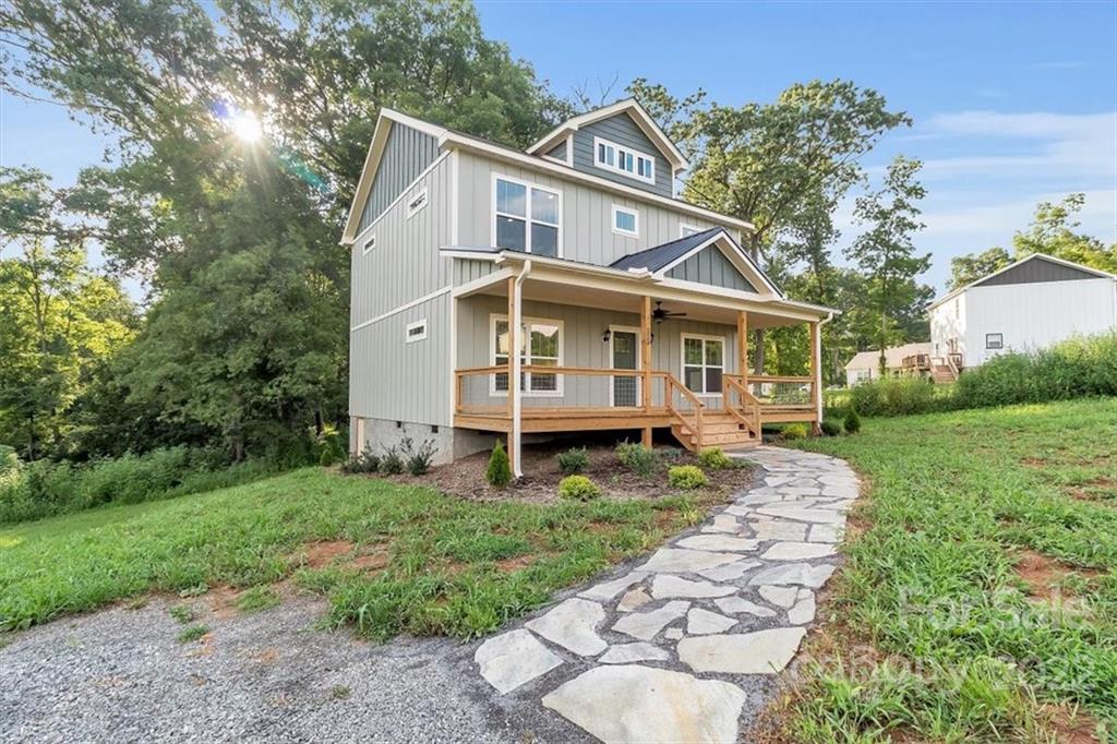 225 Ridge View Drive, Unit 16 Clyde, NC 28721 - Photo 2 of 29 a view of a house with a yard