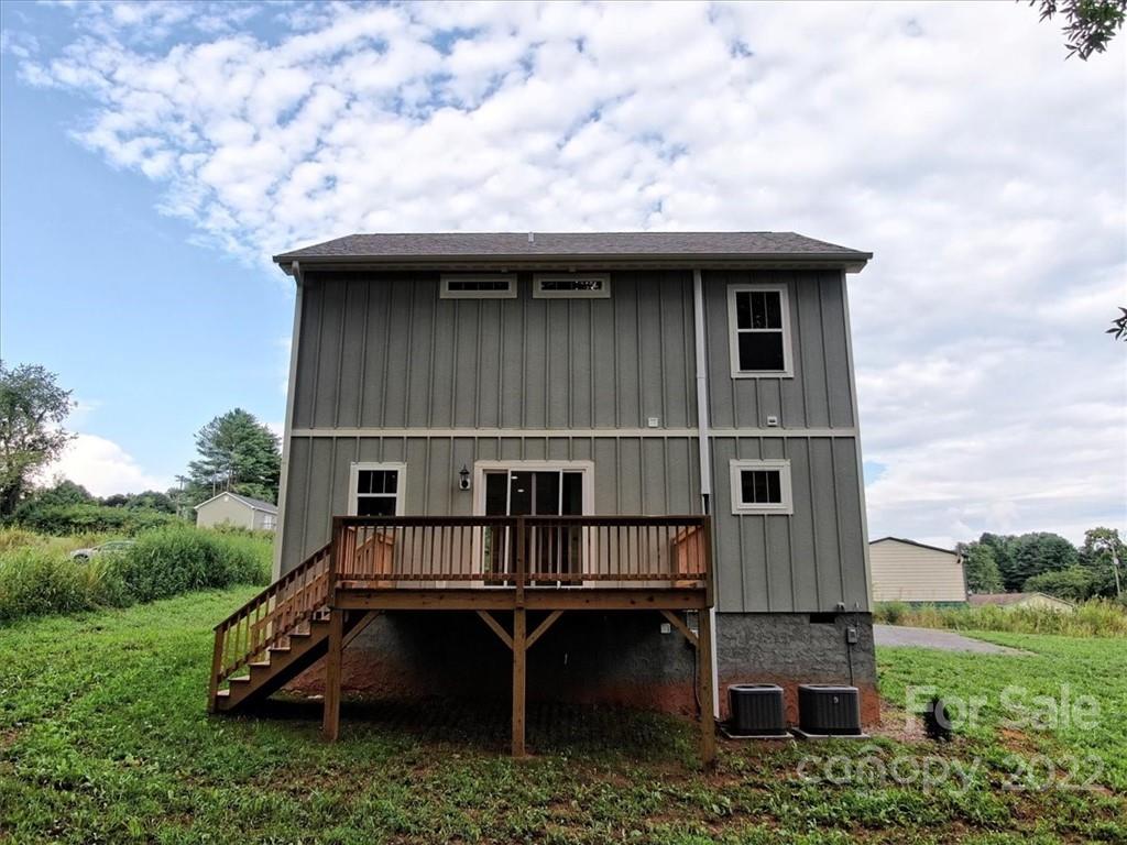 225 Ridge View Drive, Unit 16 Clyde, NC 28721 - Photo 6 of 29 an aerial view of a house with roof deck front of house