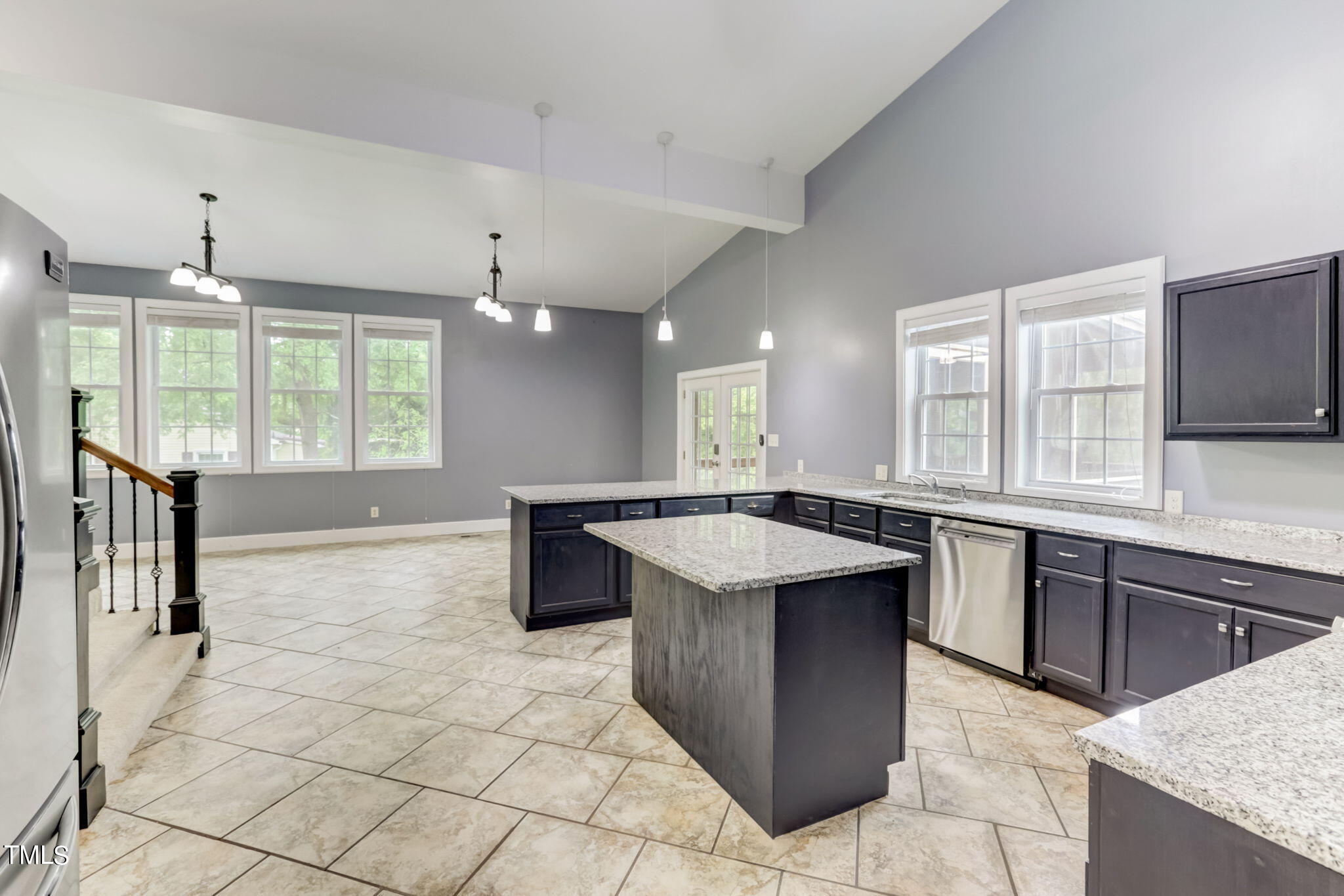 1538 Marly Drive Durham, NC 27703 - Photo 15 of 40 a kitchen with kitchen island granite countertop a sink counter top space appliances and a window