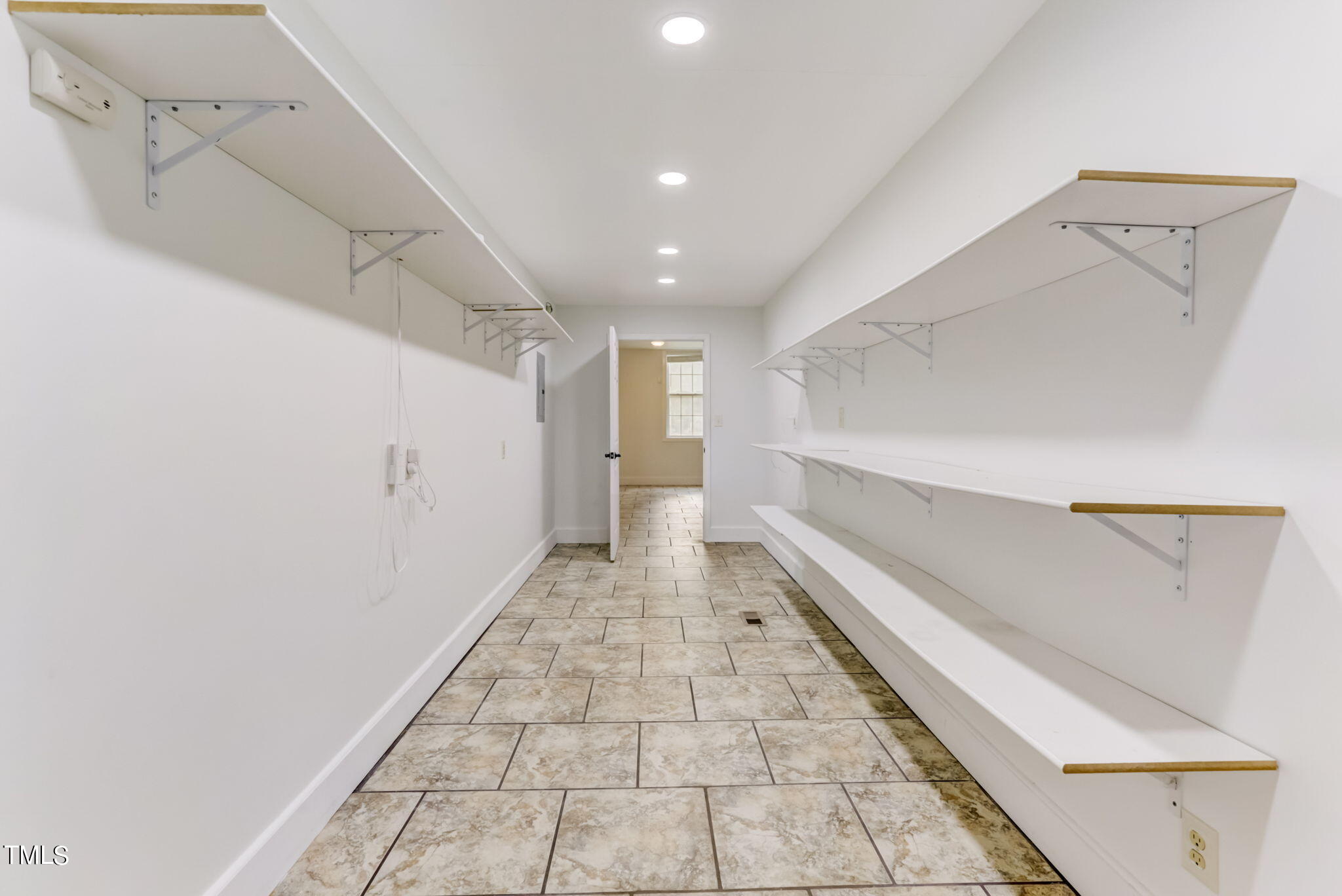 1538 Marly Drive Durham, NC 27703 - Photo 17 of 40 a hallway with white cabinets and dryer