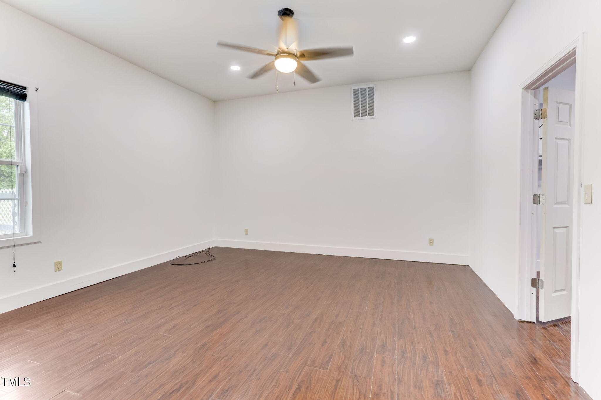 1538 Marly Drive Durham, NC 27703 - Photo 18 of 40 wooden floor in an empty room with a window