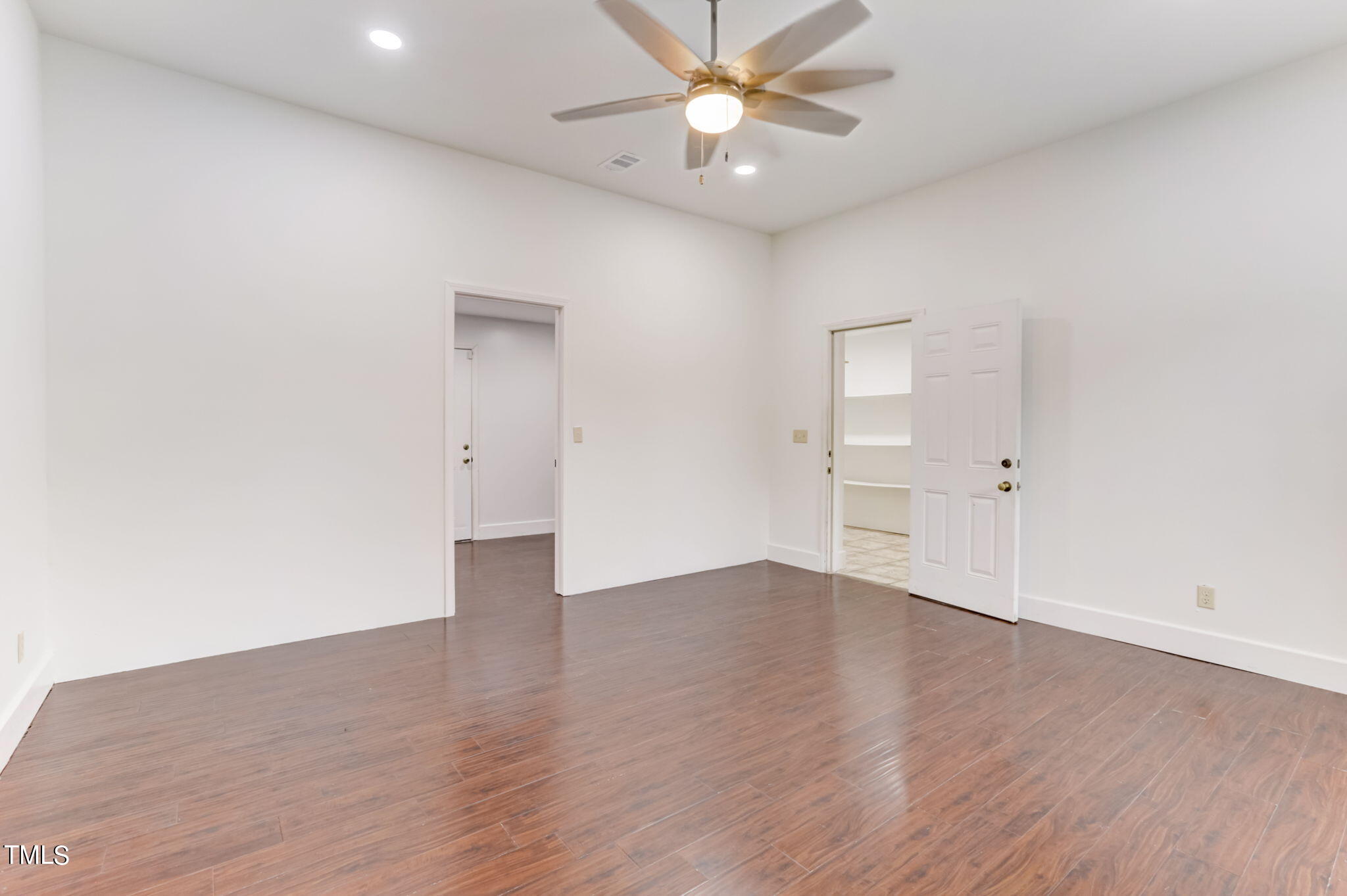 1538 Marly Drive Durham, NC 27703 - Photo 19 of 40 an empty room with wooden floor and windows