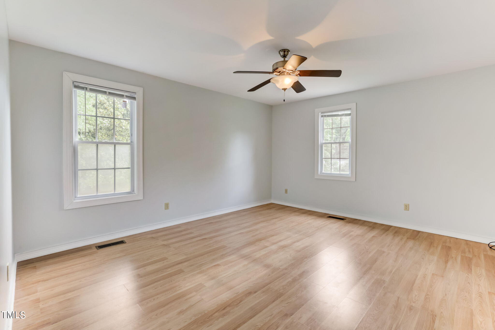 1538 Marly Drive Durham, NC 27703 - Photo 24 of 40 a view of an empty room with a window and wooden floor