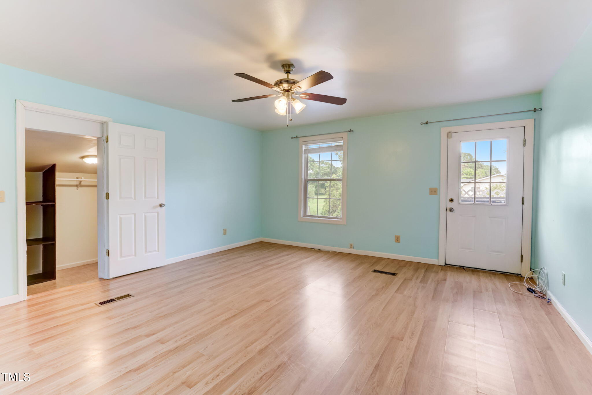 1538 Marly Drive Durham, NC 27703 - Photo 29 of 40 an empty room with wooden floor closet and windows