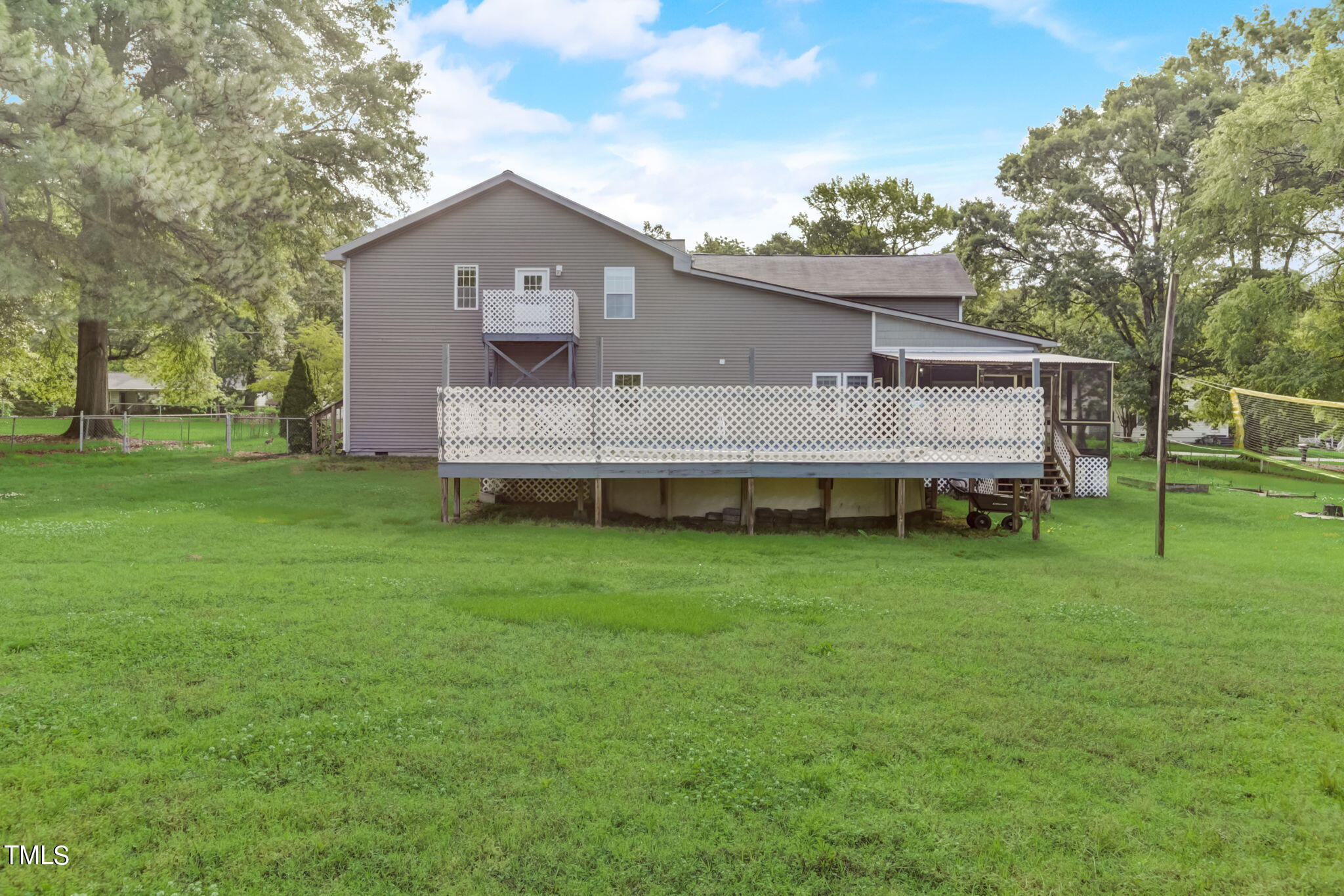 1538 Marly Drive Durham, NC 27703 - Photo 39 of 40 a front view of a house with a garden and trees