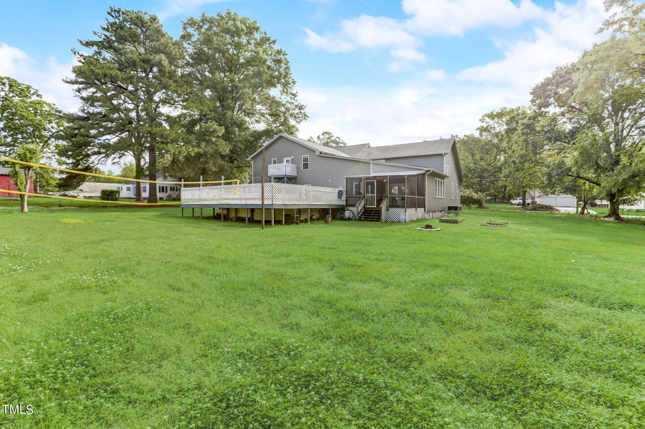 1538 Marly Drive Durham, NC 27703 - Photo 40 of 40 a view of a house with a big yard and large trees