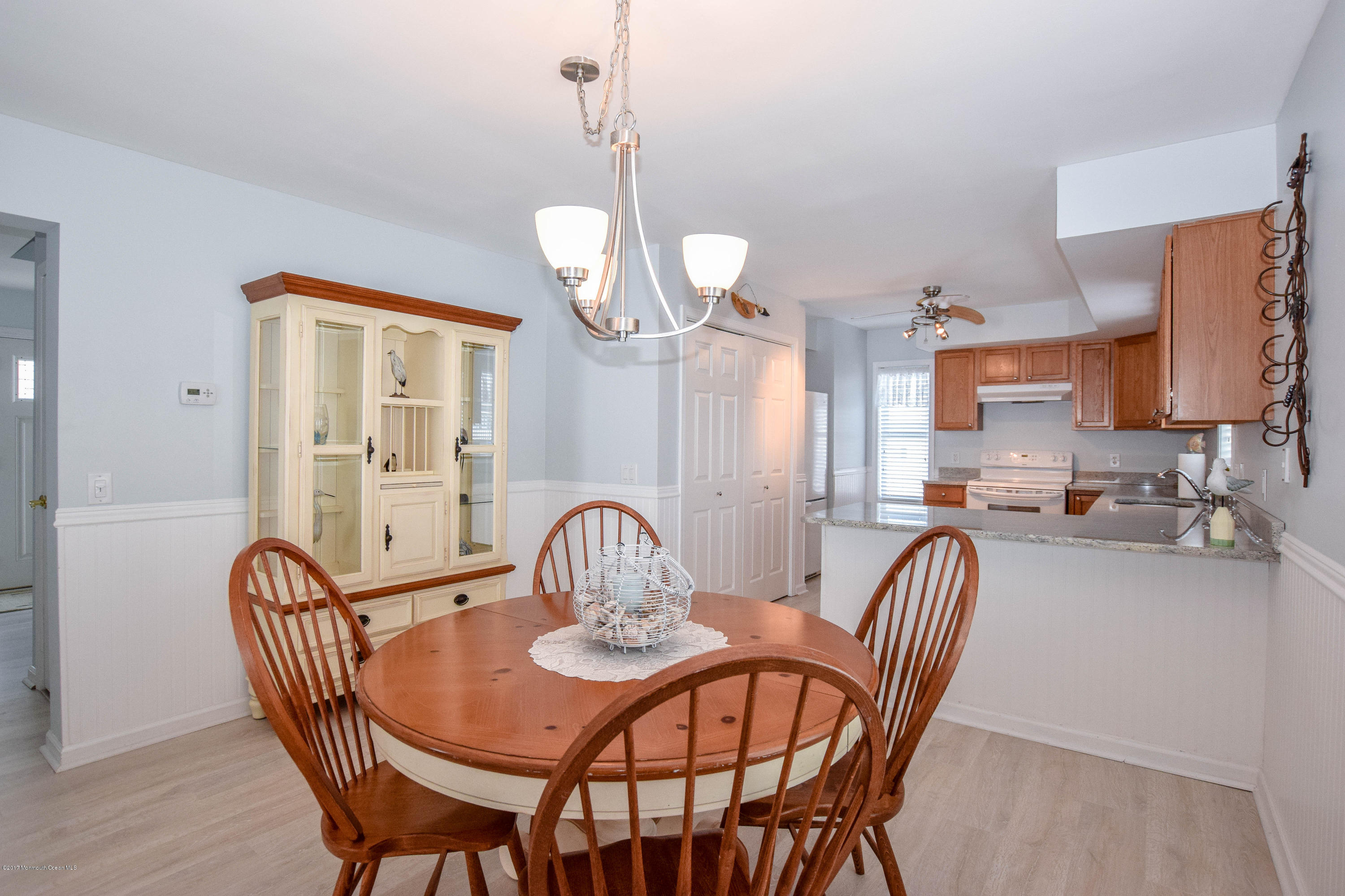 238 Heron Road Tuckerton, NJ 08087 - Photo 12 of 51 a view of a dining room with furniture a chandelier and wooden floor