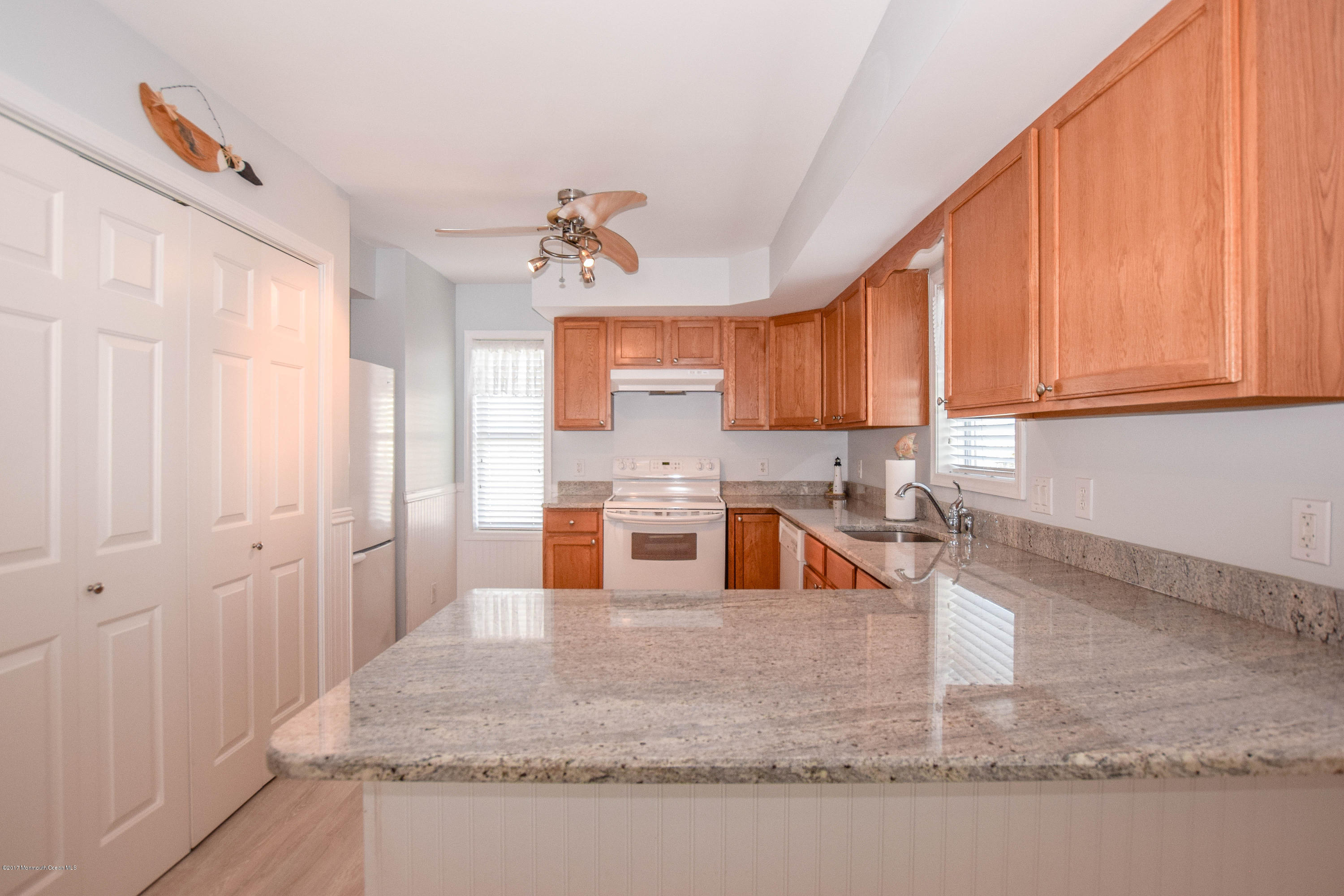 238 Heron Road Tuckerton, NJ 08087 - Photo 14 of 51 a kitchen with stainless steel appliances granite countertop a sink a stove and a refrigerator