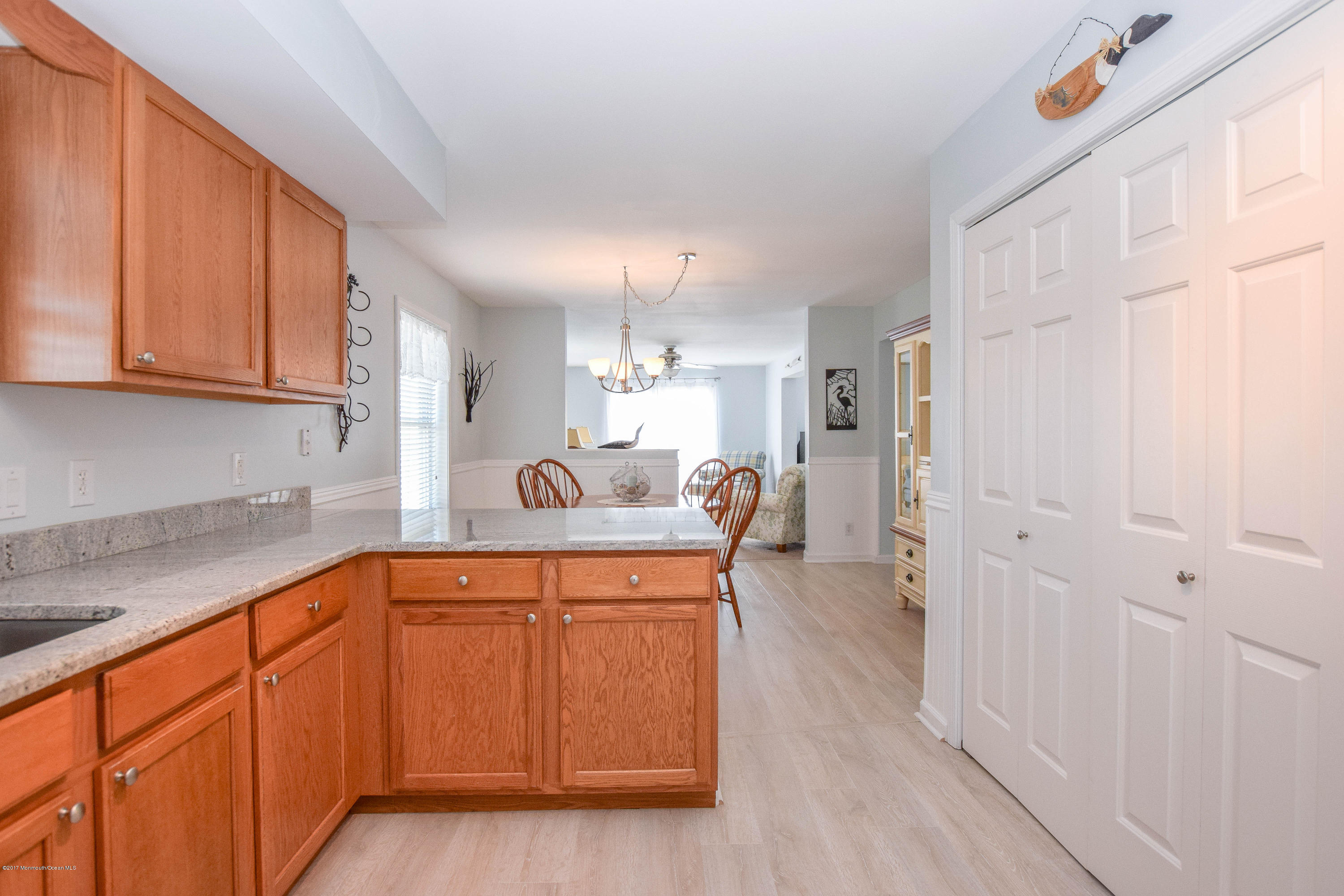 238 Heron Road Tuckerton, NJ 08087 - Photo 18 of 51 a kitchen with stainless steel appliances granite countertop a sink and cabinets with wooden floor