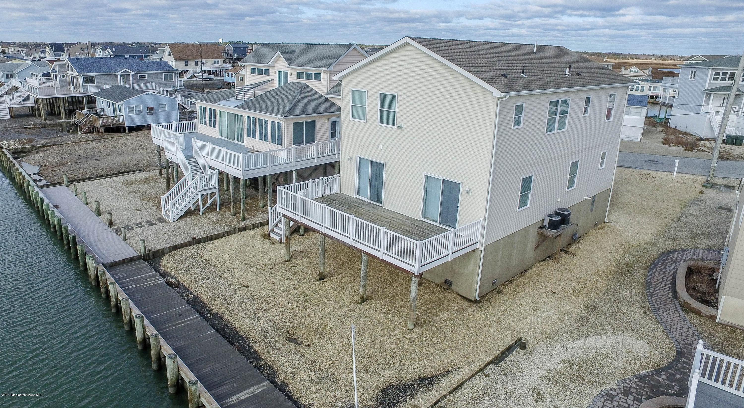 238 Heron Road Tuckerton, NJ 08087 - Photo 45 of 51 an aerial view of a house with wooden deck