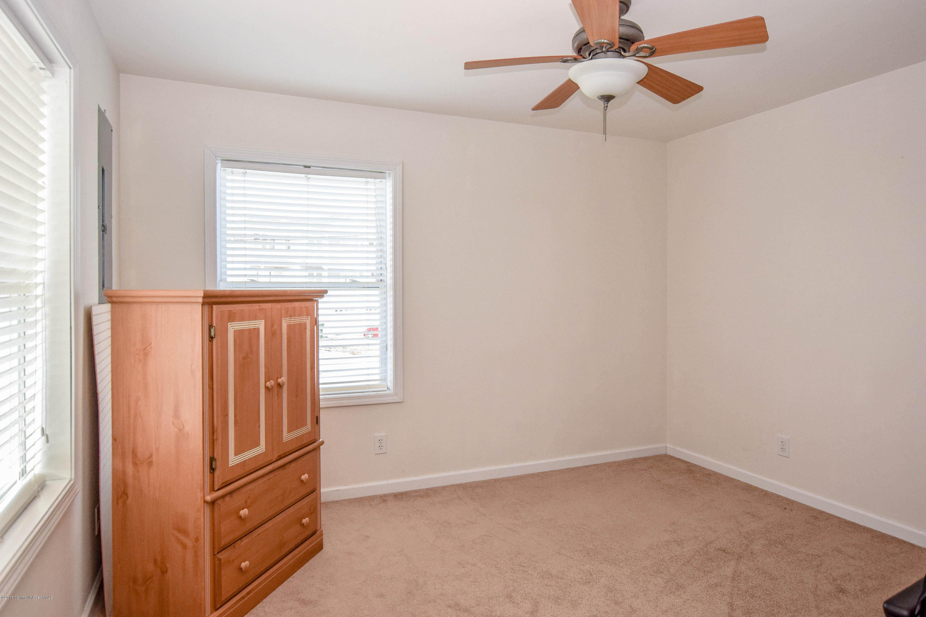 238 Heron Road Tuckerton, NJ 08087 - Photo 6 of 51 an empty room with windows and ceiling fan