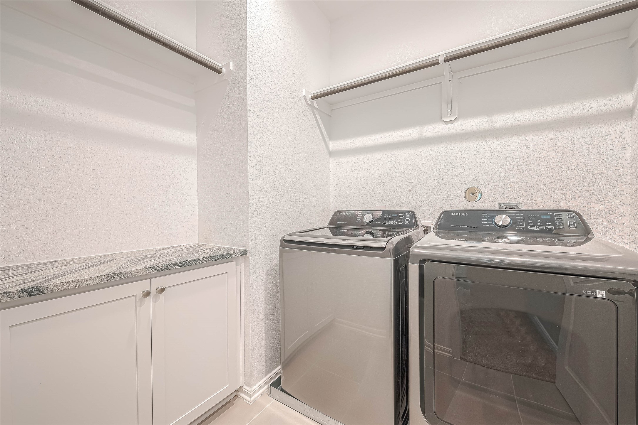 16111 Northern Cardinal Lane Cypress, TX 77433 - Photo 11 of 29 a utility room with washer and dryer