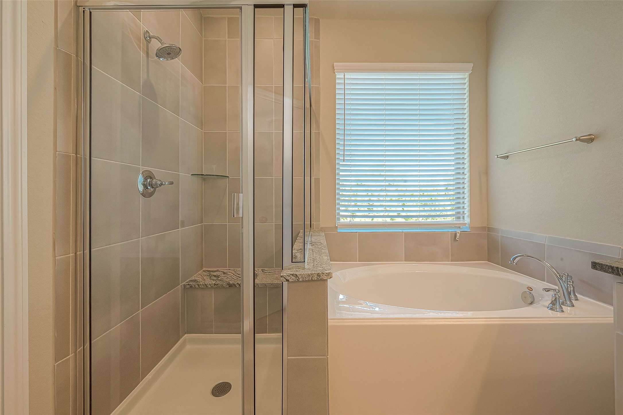 16111 Northern Cardinal Lane Cypress, TX 77433 - Photo 17 of 29 a white bath tub sitting next to a shower