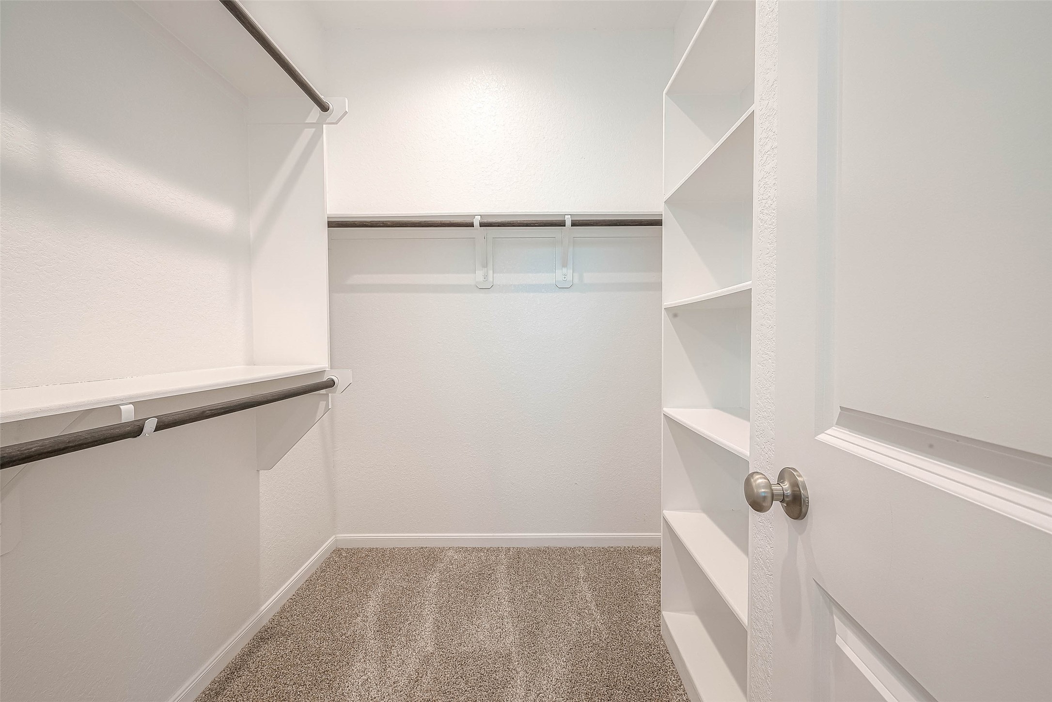 16111 Northern Cardinal Lane Cypress, TX 77433 - Photo 18 of 29 a view of walk in closet with empty racks