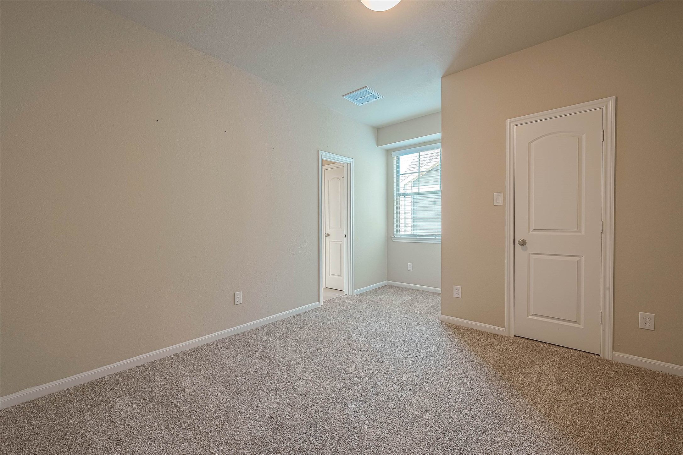 16111 Northern Cardinal Lane Cypress, TX 77433 - Photo 19 of 29 an empty room with windows and closet