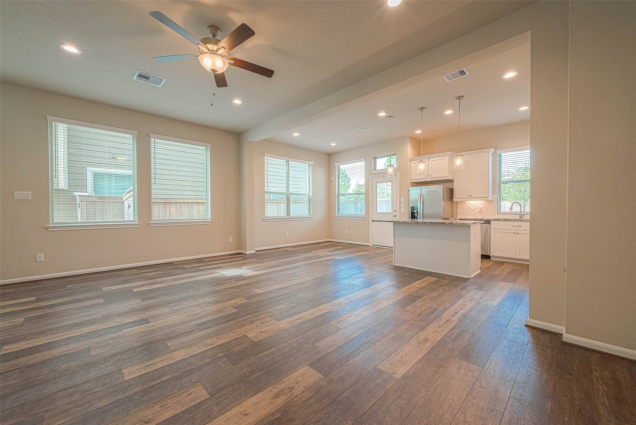 16111 Northern Cardinal Lane Cypress, TX 77433 - Photo 10 of 29 a view of an empty room with window and wooden floor