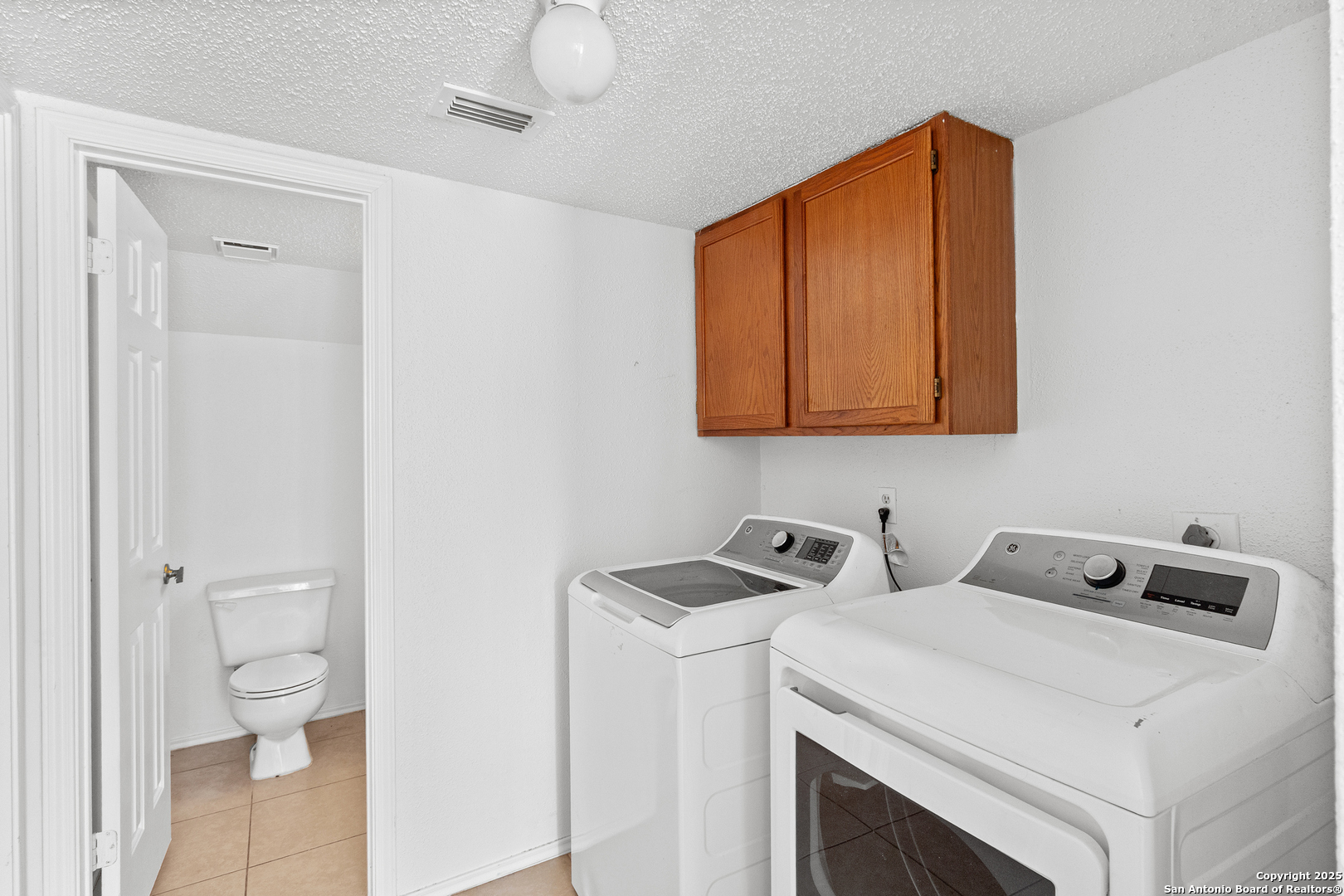25002 Silverstone San Antonio, TX 78258 - Photo 11 of 26 a utility room with dryer and washer