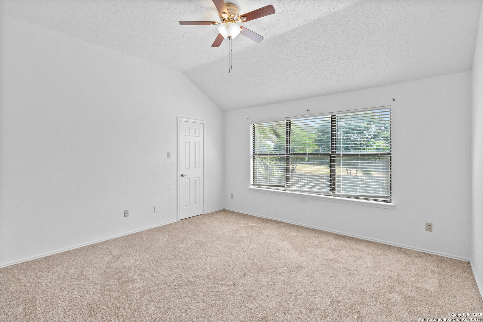25002 Silverstone San Antonio, TX 78258 - Photo 18 of 26 a view of an empty room with a window