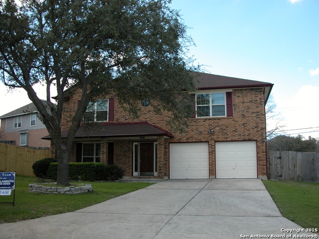 25002 Silverstone San Antonio, TX 78258 - Photo 25 of 26 a front view of a house with yard and green space