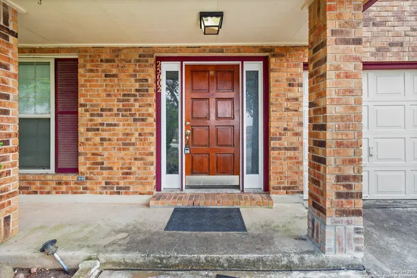 front view of a brick house with a outdoor space