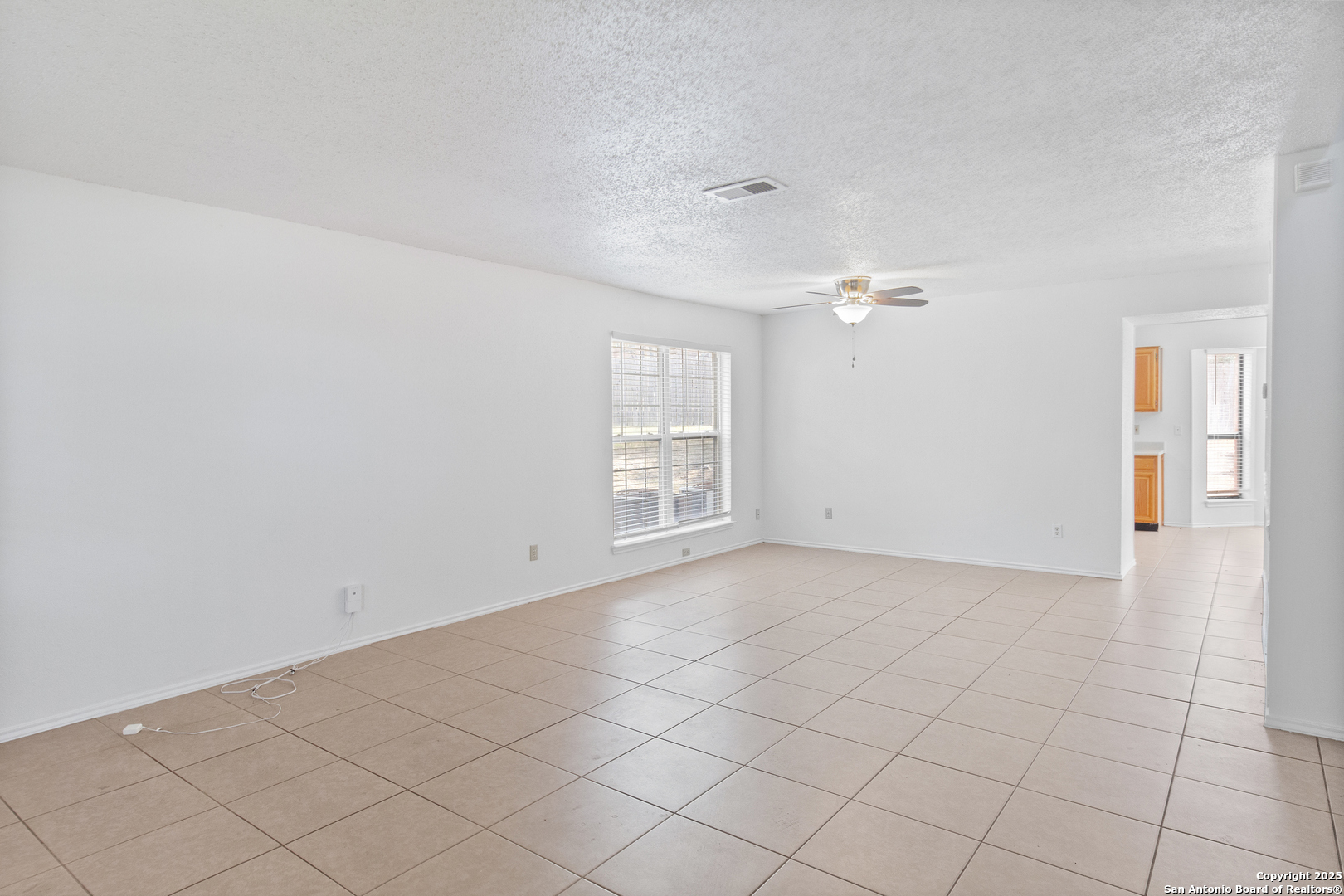 25002 Silverstone San Antonio, TX 78258 - Photo 5 of 26 a view of an empty room and window