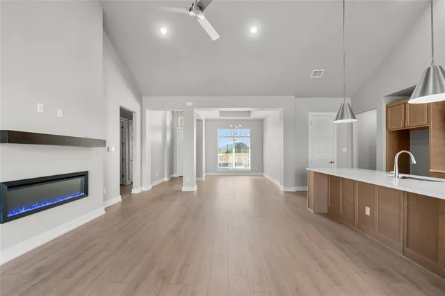 a view of a kitchen and a sink a fireplace