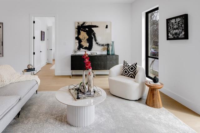 3601 Routh Street, Unit 2E Dallas, TX 75219 - Photo 1 of 14 Living area with baseboards and wood finished floors
