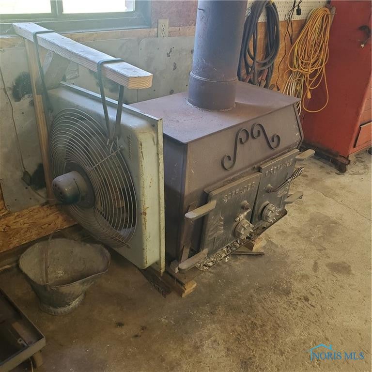 6256 Brown Road Oregon, OH 43616 - Photo 7 of 43 WOOD BURNER IN GARAGE WITH FAN