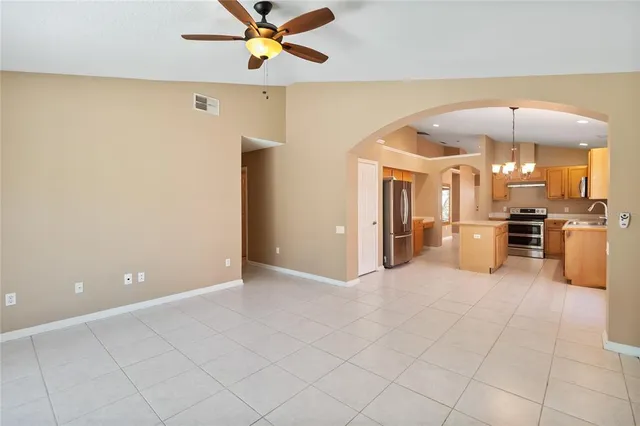 a view of a livingroom with kitchen and furniture