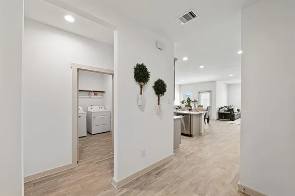 a view of kitchen with furniture and refrigerator