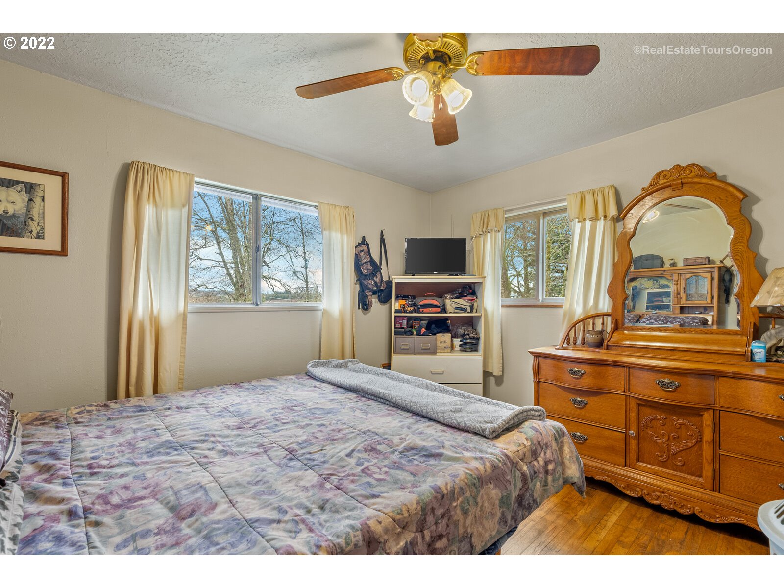 48780 Southeast Baty Road Sandy, OR 97055 - Photo 12 of 32 a bedroom with a bed and dresser with mirror