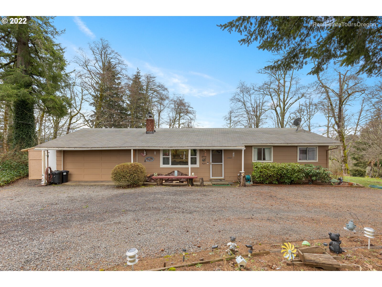 48780 Southeast Baty Road Sandy, OR 97055 - Photo 2 of 32 a front view of a house with a garden