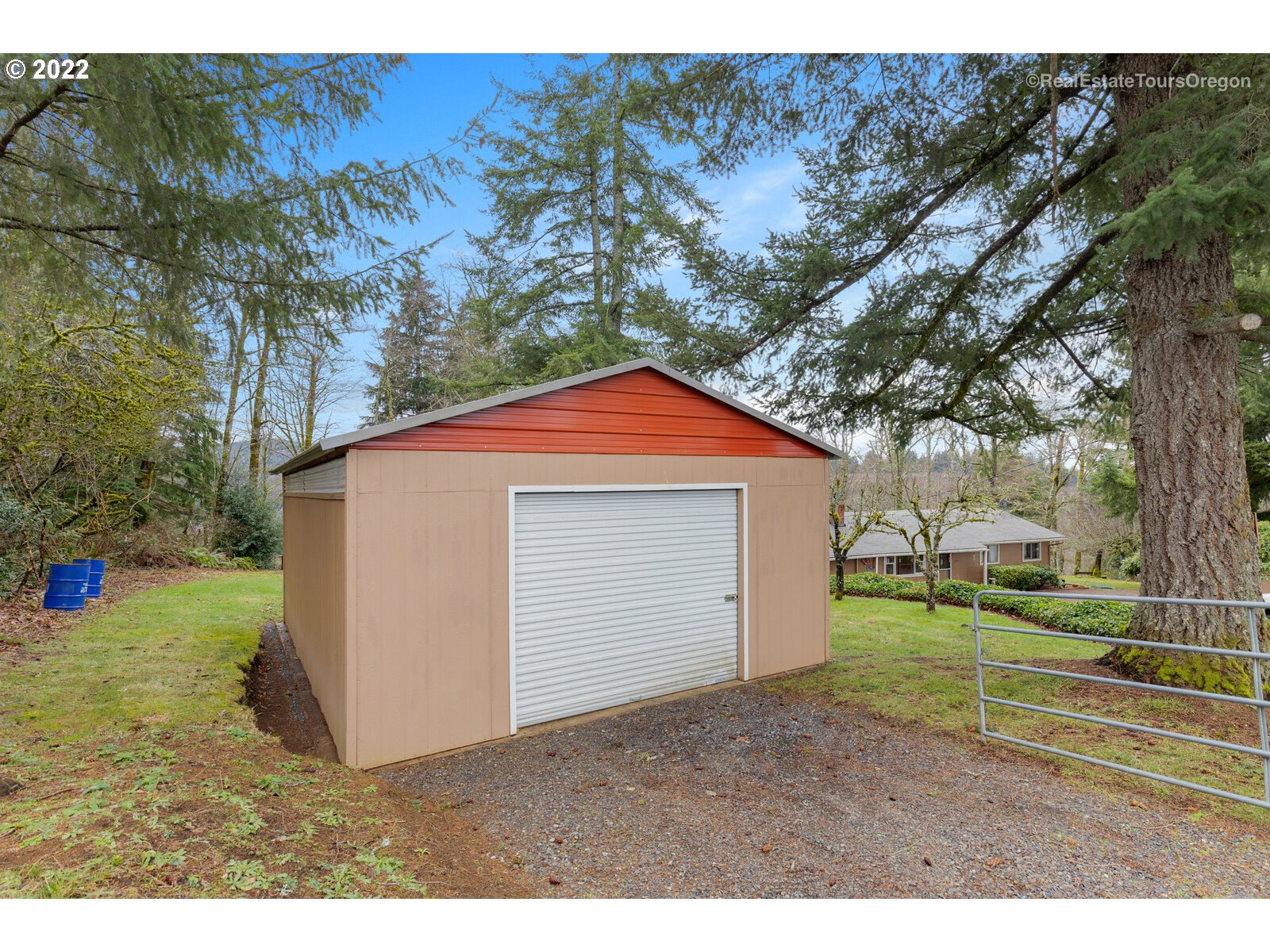 48780 Southeast Baty Road Sandy, OR 97055 - Photo 27 of 32 a view of a backyard with a barn and large trees