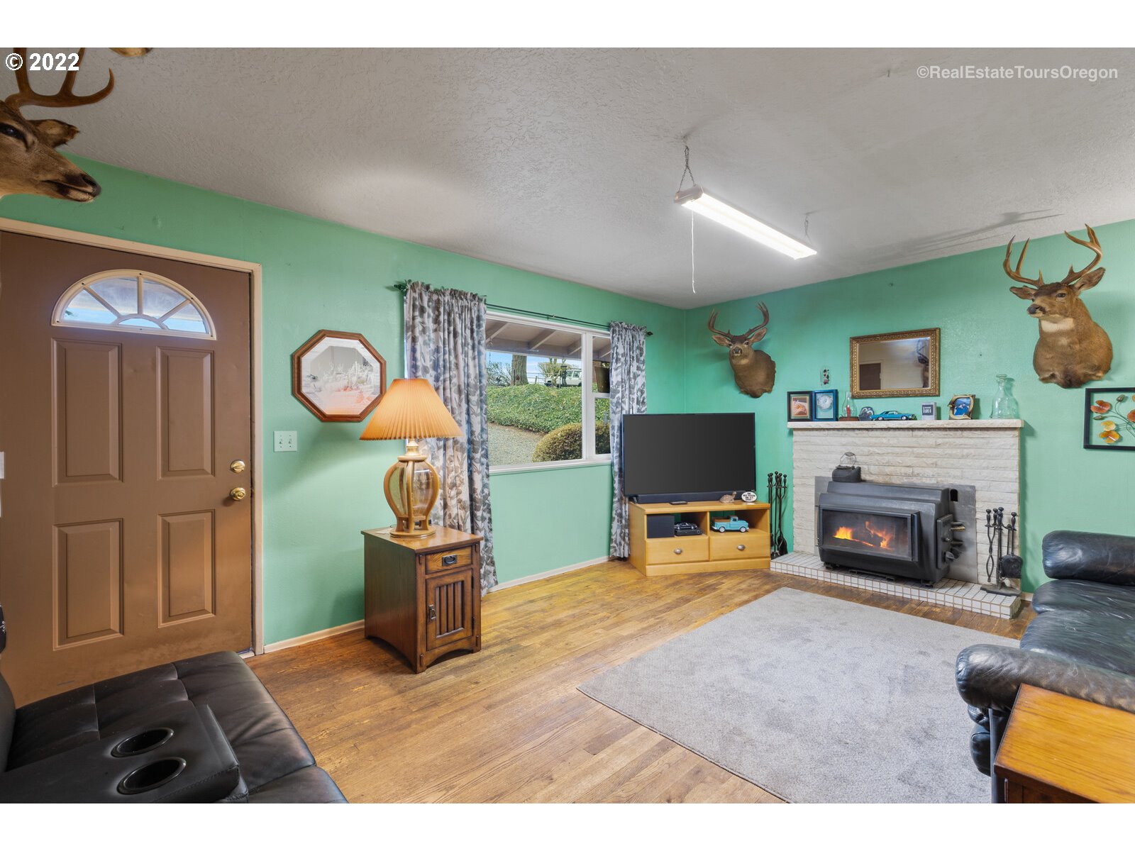 48780 Southeast Baty Road Sandy, OR 97055 - Photo 5 of 32 a living room with furniture and a fireplace