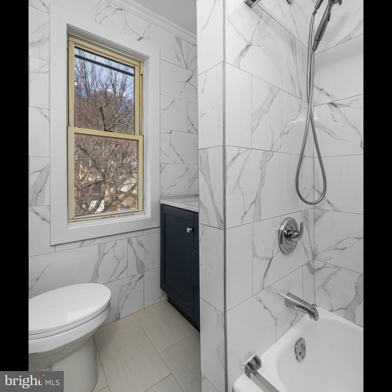 246 Powell Road Springfield, PA 19064 - Photo 13 of 29 a bathroom with a toilet and shower