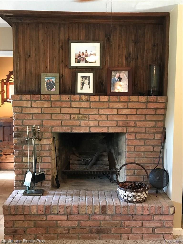 7150 Denton Hill Road Fenton, MI 48430 - Photo 13 of 47 Natural fireplace in the family room for those cozy winter evenings.