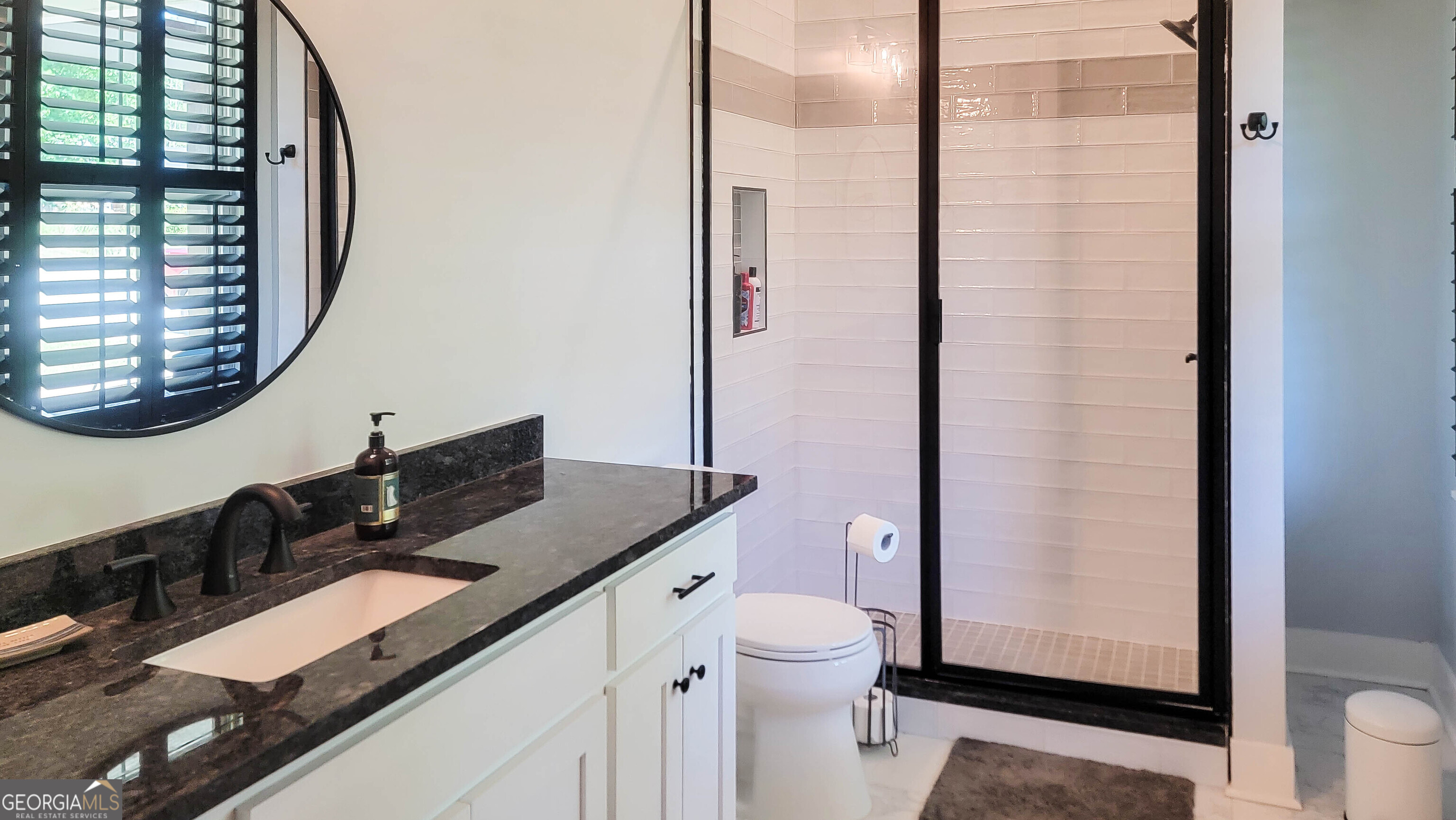 209 Lee Road Salem, AL 36874 - Photo 29 of 37 a bathroom with a granite countertop sink and a mirror