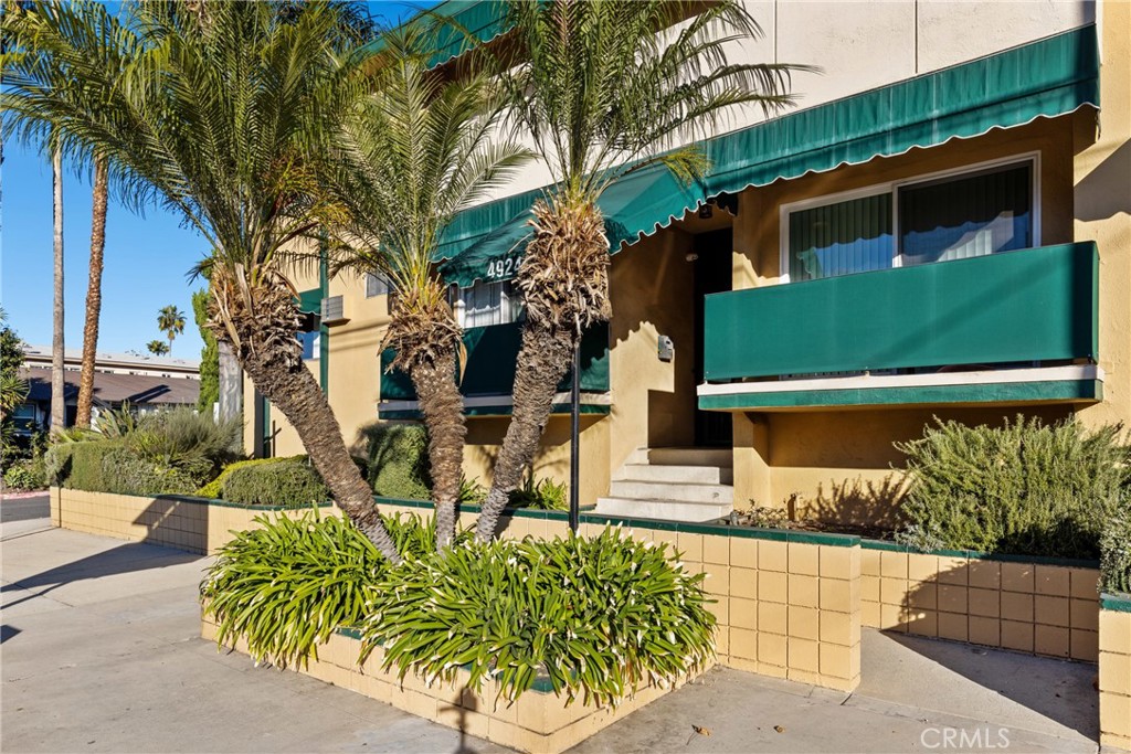 4924 Kester Avenue, Unit 10 Sherman Oaks, CA 91403 - Photo 1 of 17 a front view of a house with garden