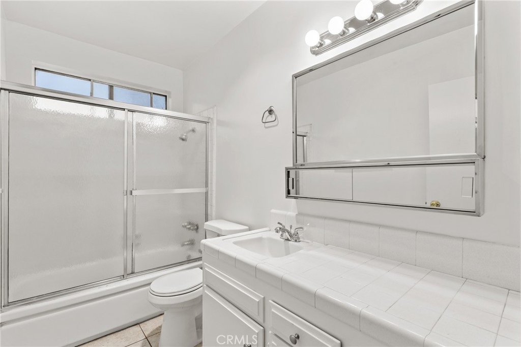 4924 Kester Avenue, Unit 10 Sherman Oaks, CA 91403 - Photo 14 of 17 a bathroom with a sink toilet and shower