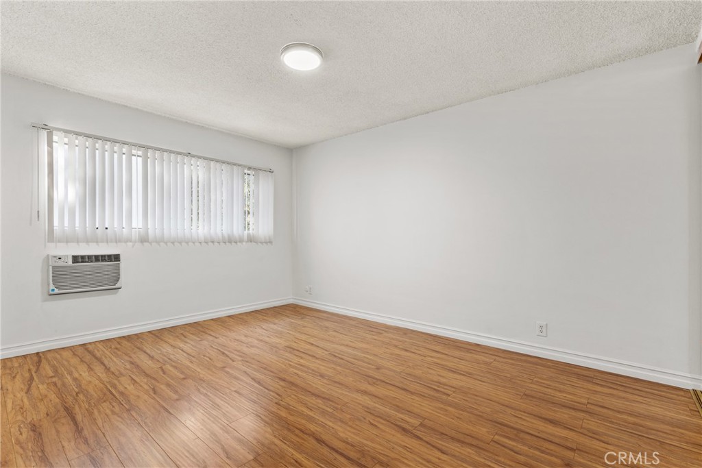 4924 Kester Avenue, Unit 10 Sherman Oaks, CA 91403 - Photo 15 of 17 wooden floor in an empty room with a window