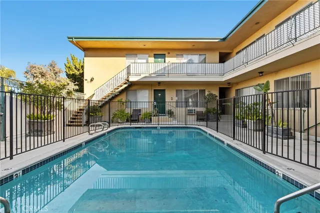 a view of swimming pool with outdoor seating