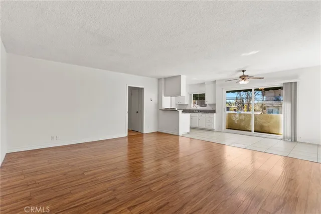 a view of a kitchen with wooden floor