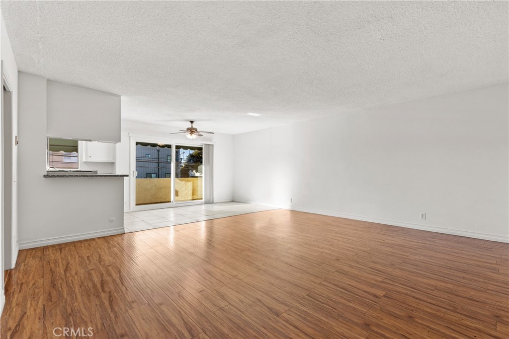 4924 Kester Avenue, Unit 10 Sherman Oaks, CA 91403 - Photo 3 of 17 a view of wooden floor and a kitchen