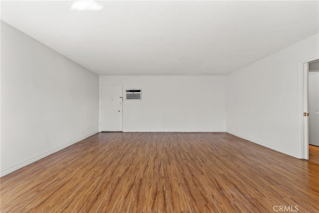 4924 Kester Avenue, Unit 10 Sherman Oaks, CA 91403 - Photo 5 of 17 a view of an empty room with wooden floor