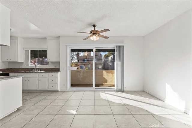 a view of a kitchen with a sink and a window