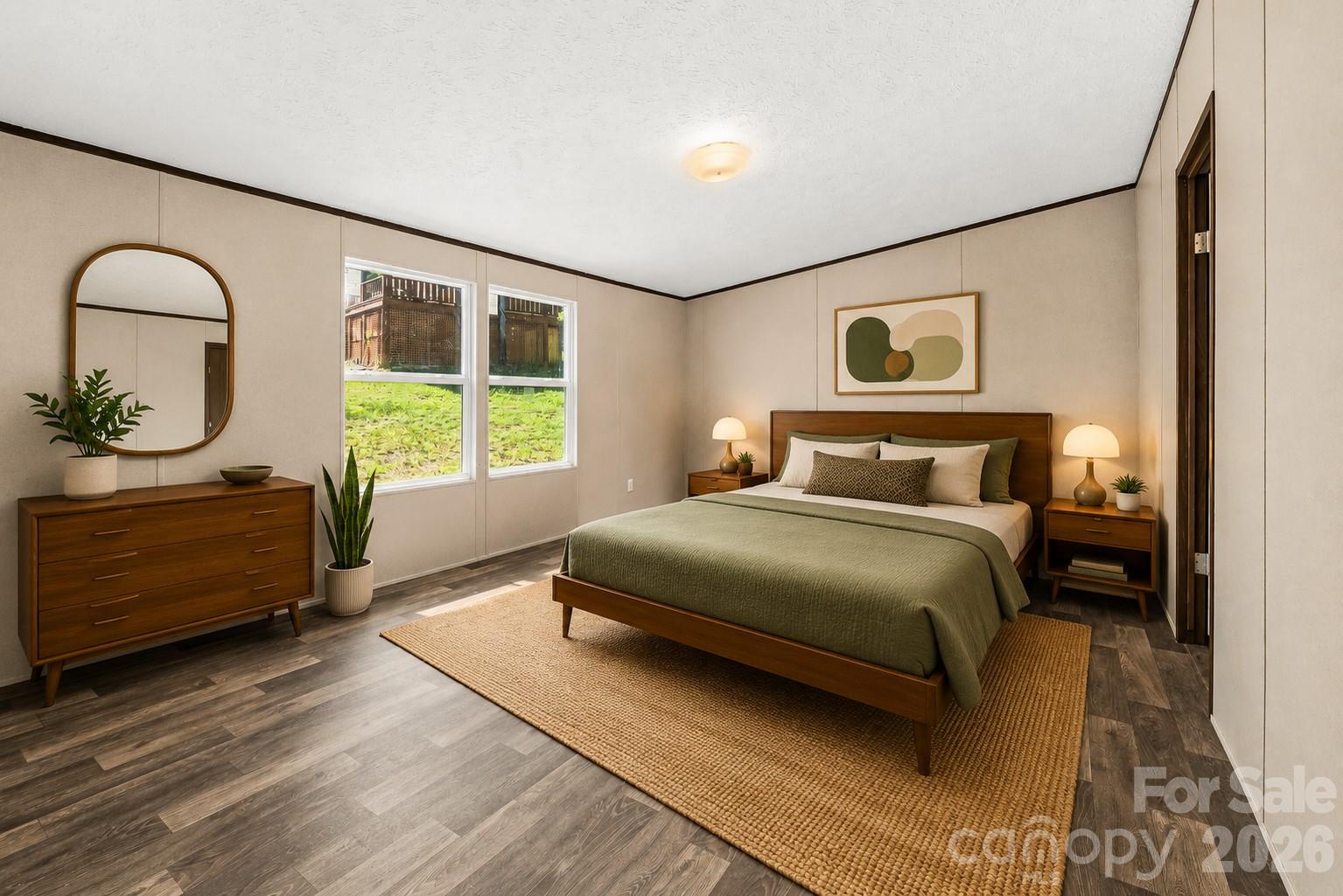 45 Alan Retreat Road Hendersonville, NC 28792 - Photo 16 of 25 a bedroom with a bed and a dresser next to a window