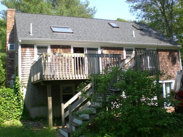 12 Radcliffe Road Mashpee, MA 02649 - Photo 9 of 9 a front view of a house with a garden