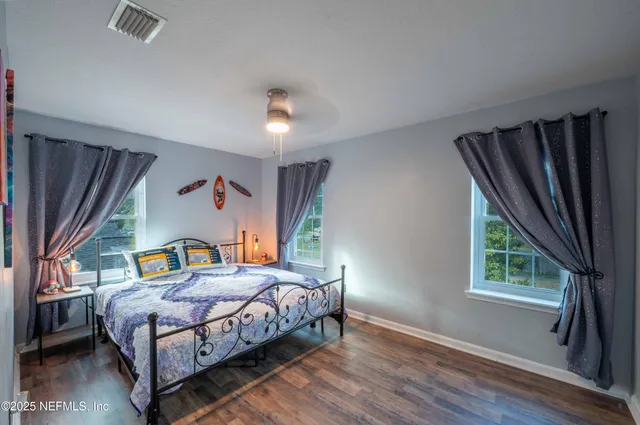 a bedroom with a bed and a table