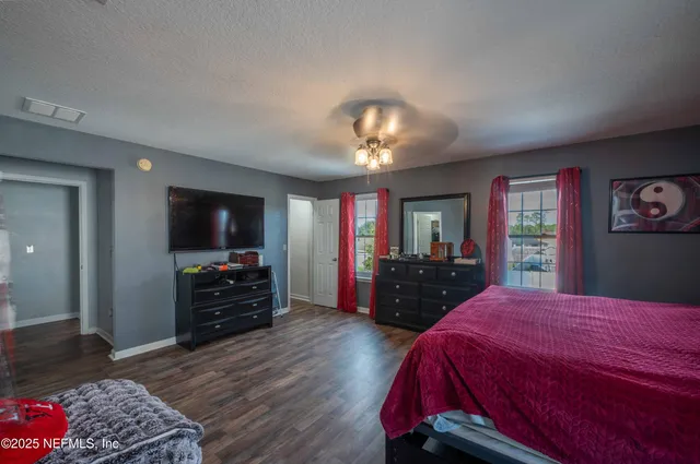 a bed room with a bed and a dresser