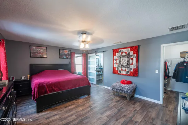 a bathroom with a sink mirror and toilet